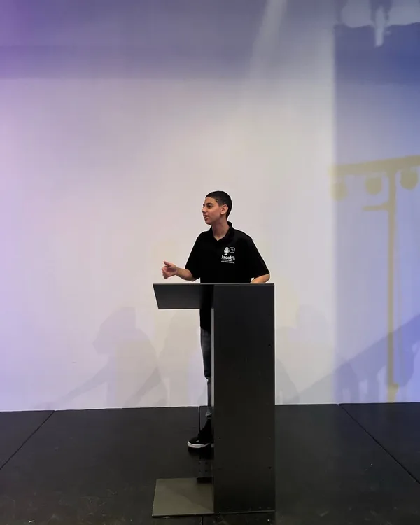 Jacob speaking at an event